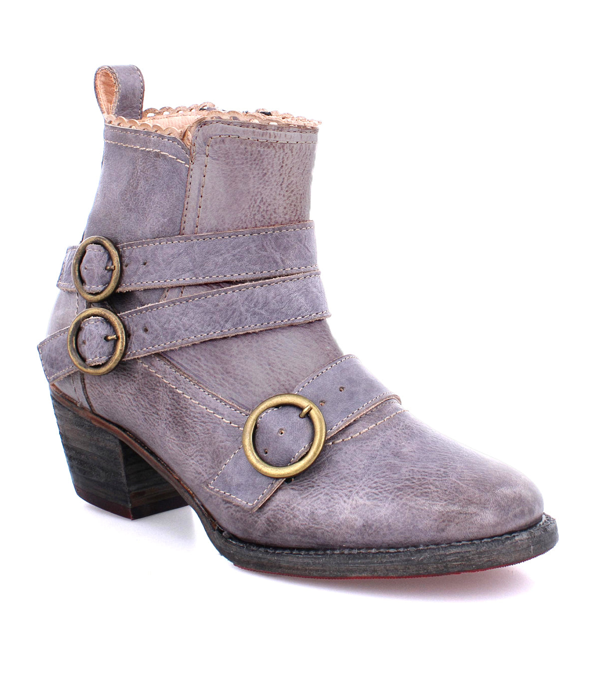 A gray short leather boot with two decorative brass buckles and a short heel, featuring a textured leather finish, the Bady by Oak Tree Farms.