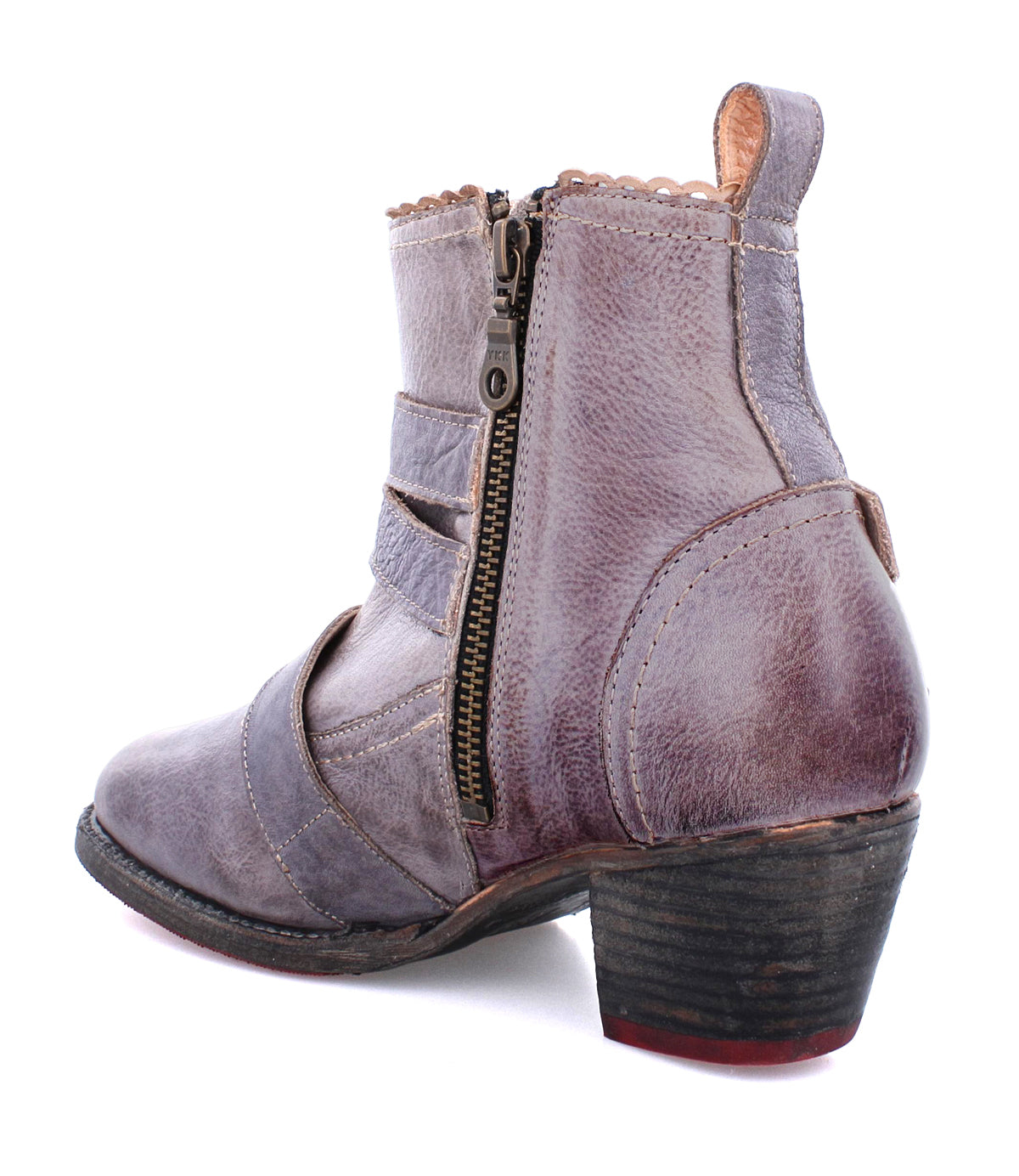 A single weathered purple handmade leather ankle boot with a side zipper, adorned with brass buckles and a low, chunky heel, called Bady by Oak Tree Farms.