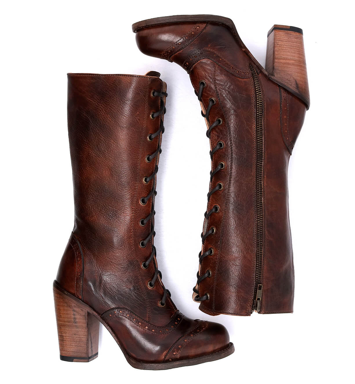 A pair of Oak Tree Farms Ariana women's brown leather boots with wooden heels.