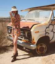 A woman in a hat standing next to an Oak Tree Farms Baila.