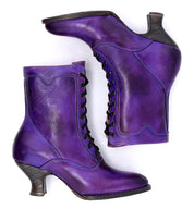 A pair of Oak Tree Farms "Eleanor" Victorian style purple leather boots on a white background, hand dyed for uncompromising quality.