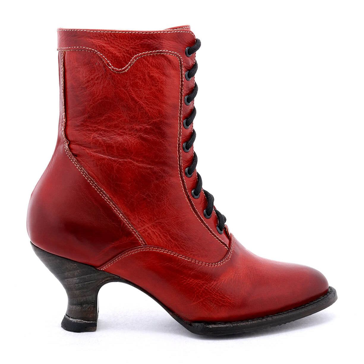 An uncompromising quality women's red leather ankle boot, the Eleanor by Oak Tree Farms, with a hand-dyed finish, showcased against a white background.
