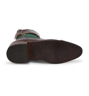 A pair of Oak Tree Farms Faye handcrafted leather riding boots with a buckle on the side.