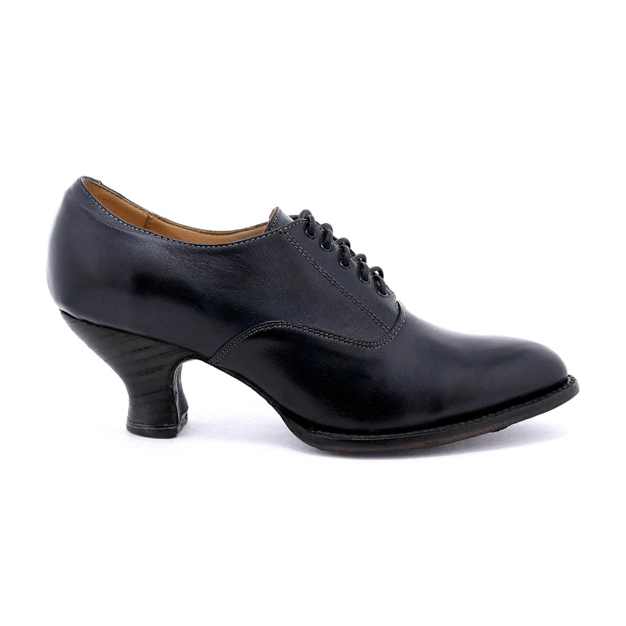 A women's black oxford shoe named "Janet" from the brand "Oak Tree Farms" with a lace-up design and spooled heel, set on a white background.
