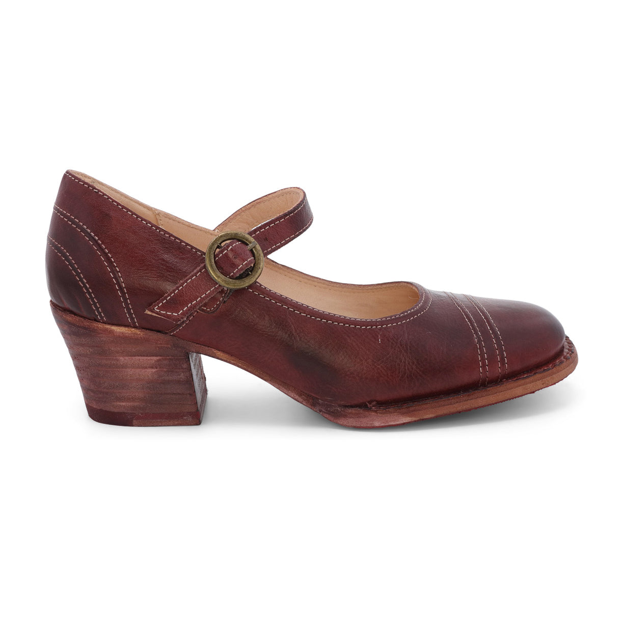 The Oak Tree Farms Twigley is a stylish women's mary jane shoe in burgundy with a wooden heel. This leather shoe combines the classic Mary Jane style with a touch of modern sophistication.