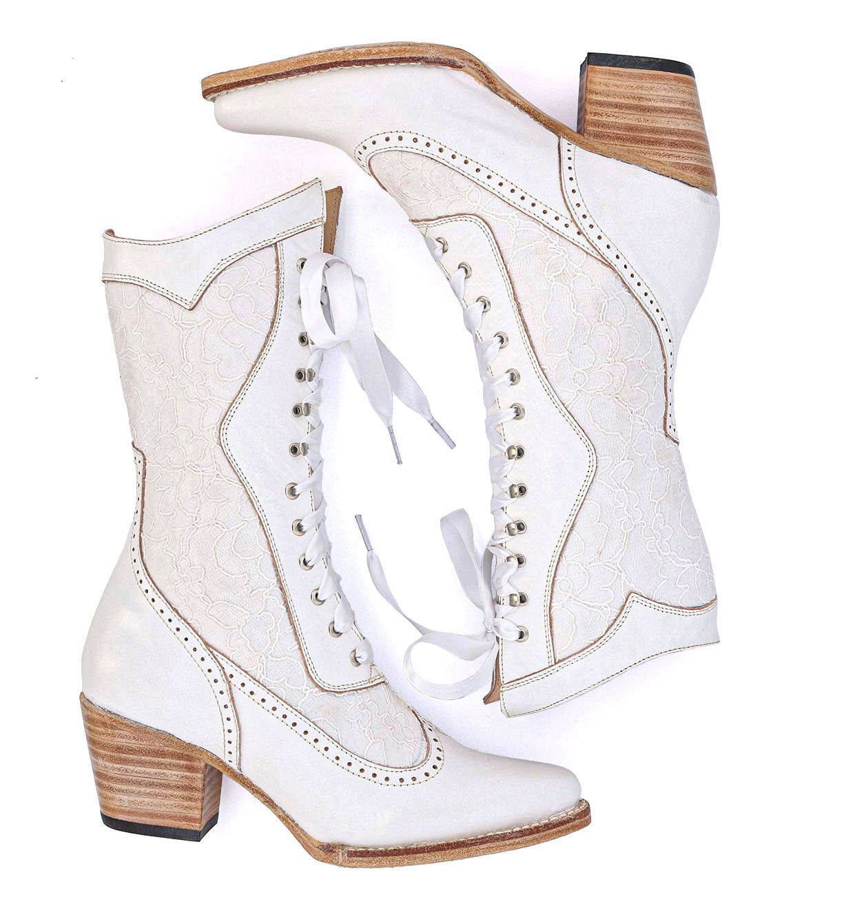 A pair of Oak Tree Farms Biddy white cowboy boots on a white background.