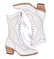 A pair of Oak Tree Farms Biddy white cowboy boots on a white background.