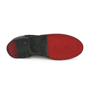A black and red Oak Tree Farms Maude shoe with a red sole.