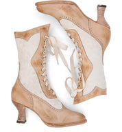 A pair of handmade Oak Tree Farms Abigale beige leather boots with charming lace-up details.
