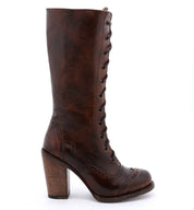 An Ariana boot from Oak Tree Farms, hand-tooled with wooden heel and lace detail.