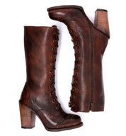 A pair of Oak Tree Farms Ariana women's brown leather boots with wooden heels.