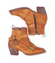 A pair of Oak Tree Farms Bady tan leather ankle boots with real leather and buckles.