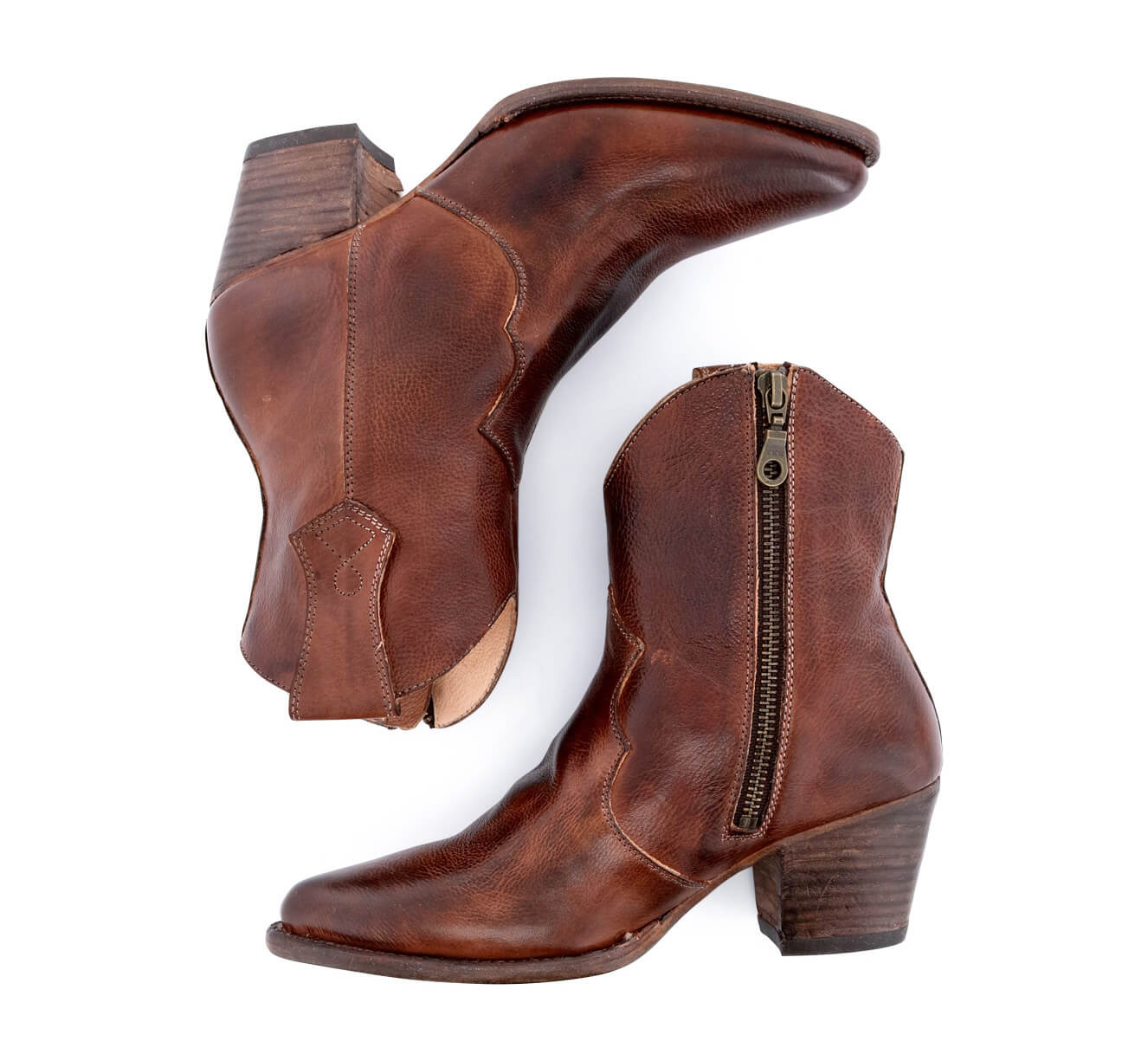 A pair of Oak Tree Farms Baila cowboy boots with zippers on the sides.