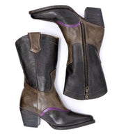 A hand-tooled pair of black and purple Oak Tree Farms Basanti leather cowboy boots.