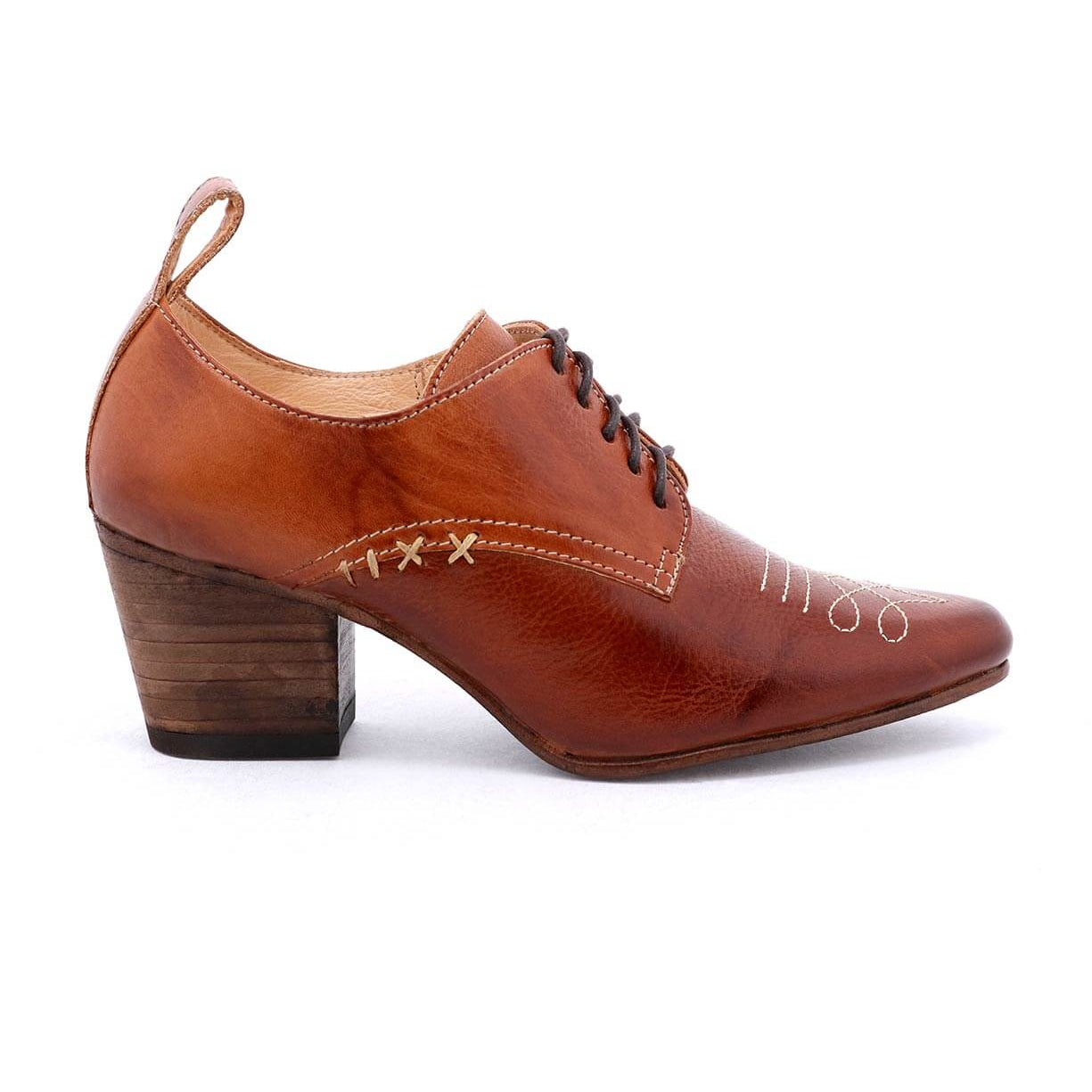 A Victorian-inspired women's Braunstone oxford shoe by Oak Tree Farms with a leather lace-up design and a wooden heel, making it the perfect dress shoe.