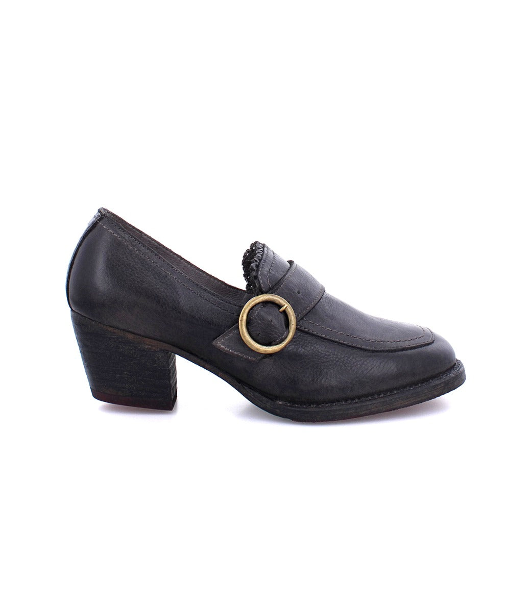 A women's black leather loafer with a gold buckle, perfect for the Oak Tree Farms Dyba or Diva looking for a stylish and comfortable shoe.