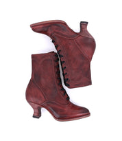 A pair of Oak Tree Farms Eleanor Victorian-style burgundy leather boots on a white background, showcasing uncompromising quality.