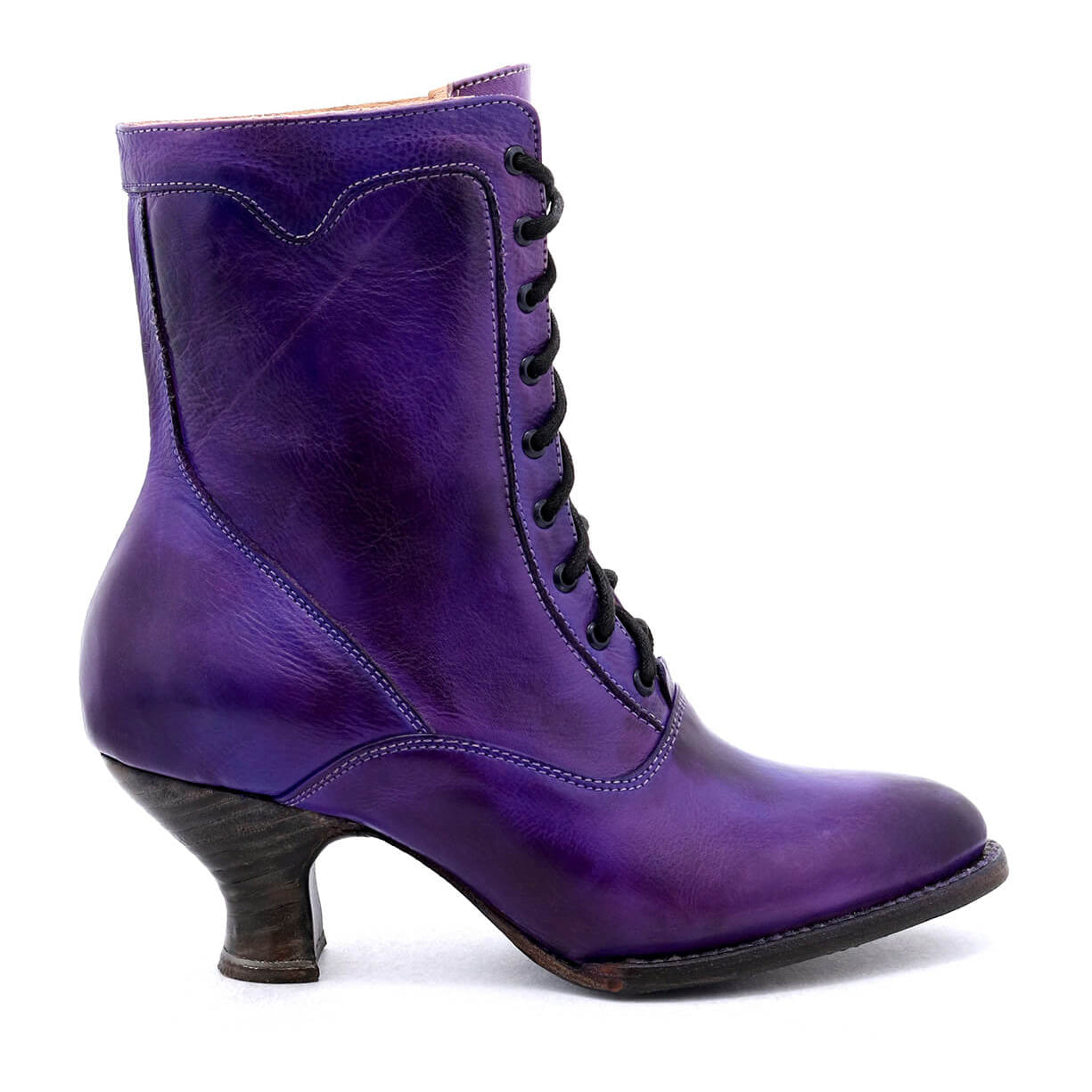 A Victorian style women's purple leather ankle boot, crafted with uncompromising quality and hand-dyed, called the Eleanor by Oak Tree Farms.