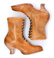 A pair of Eleanor Victorian-style tan leather boots by Oak Tree Farms on a white background, hand-dyed with uncompromising quality.