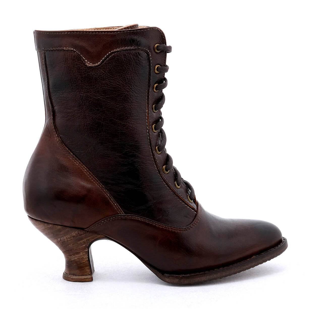 An Eleanor women's brown leather boot with wooden heel, hand dyed to ensure uncompromising quality, crafted by Oak Tree Farms.
