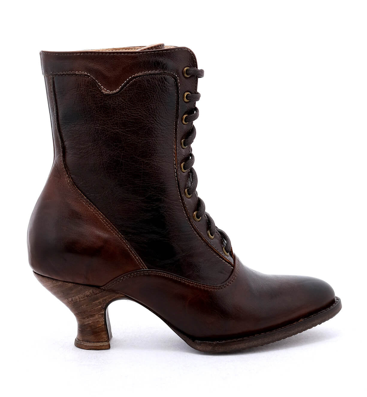 An Eleanor women's brown leather boot with wooden heel, hand dyed to ensure uncompromising quality, crafted by Oak Tree Farms.