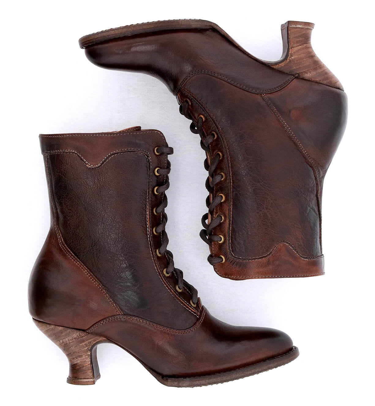 A pair of Eleanor Victorian style brown leather boots by Oak Tree Farms on a white background, showcasing uncompromising quality.