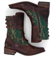 A handcrafted pair of Faye boots by Oak Tree Farms, in brown and green with zippers, perfect for riding.