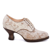A women's beige lace up oxford shoe with a neutral look on a white background, the Janet shoe by Oak Tree Farms.