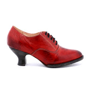 A women's red oxford shoe named Janet, made by Oak Tree Farms, with a lace up front on a white background.