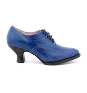 A lace-up front women's blue oxford shoe named "Janet" by Oak Tree Farms, with a neutral look, showcased on a white background.