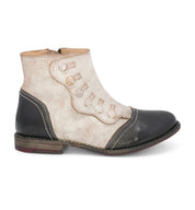 A black and white women's Josephine ankle boot with leather detailing by Oak Tree Farms.
