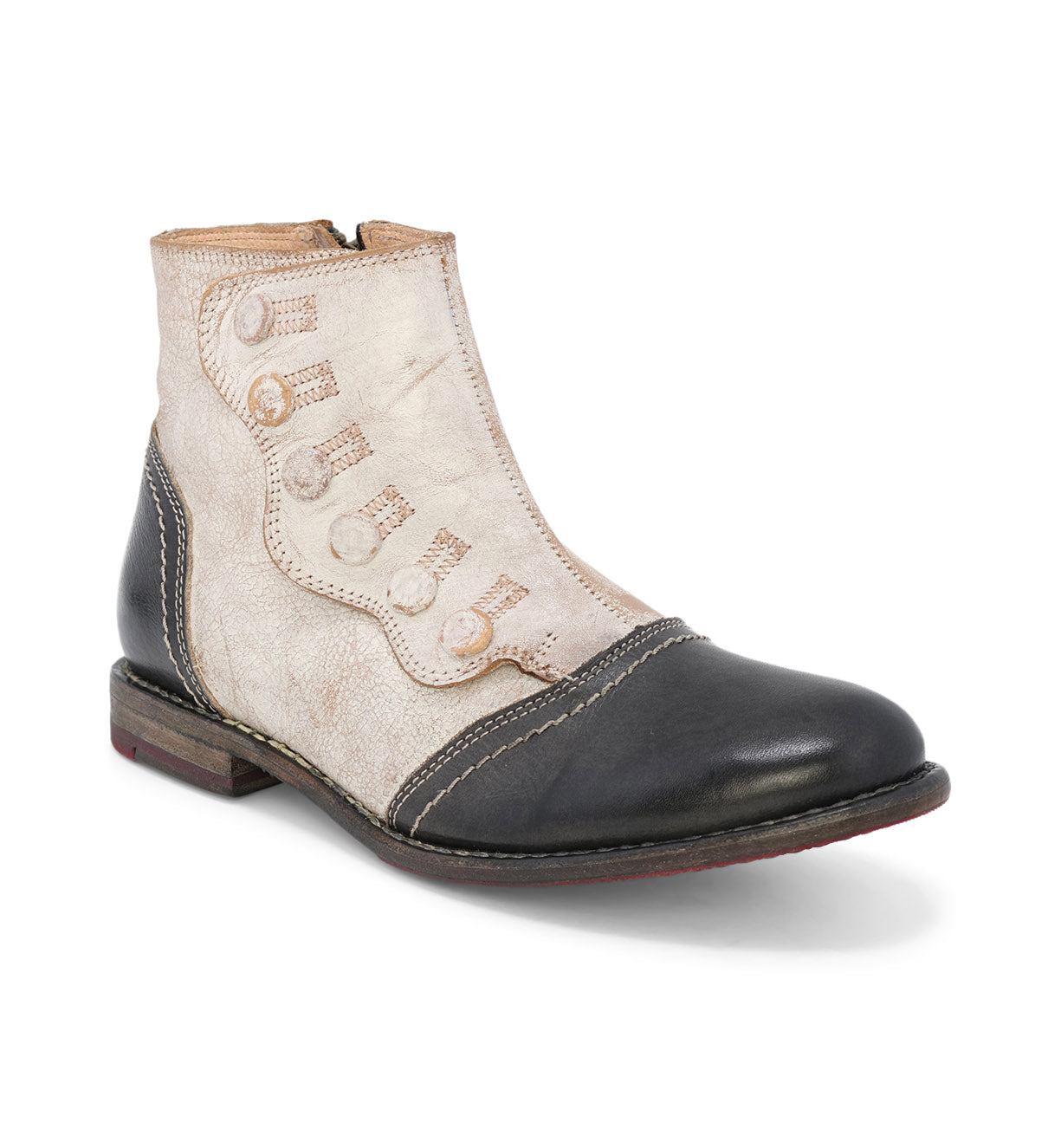 An Oak Tree Farms Josephine women's ankle bootie with black and white detailing and a YKK zipper.