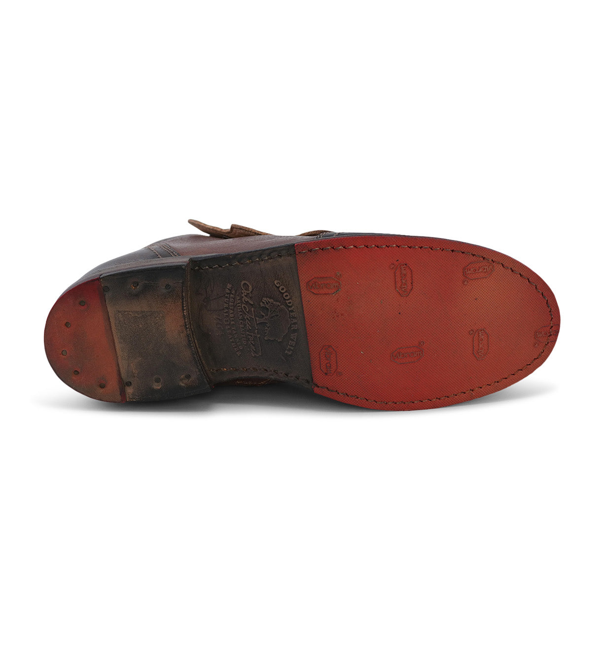 A pair of Oak Tree Farms Josephine brown leather shoes with red soles.