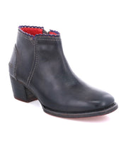 A comfortable women's black ankle boot with red detailing, the Oak Tree Farms Mini.