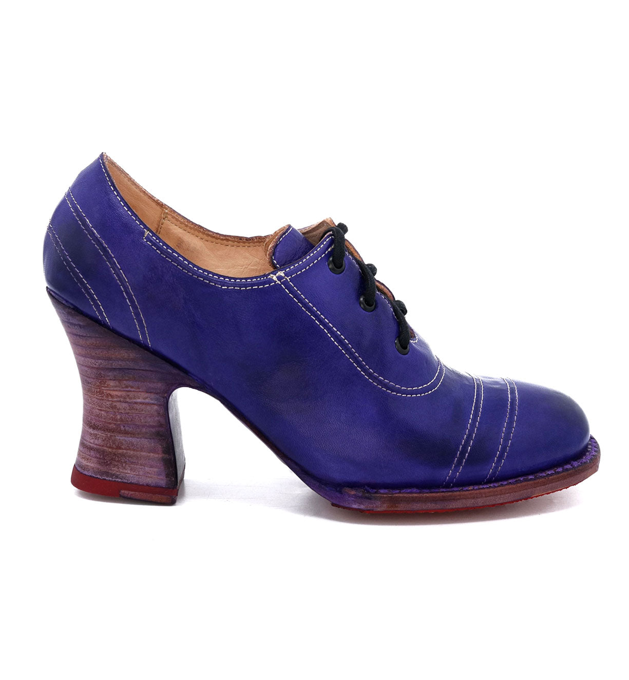 A women's Oak Tree Farms Nanny enchanting blue oxford shoe with a wooden heel.