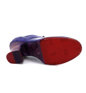 A pair of enchanting Nanny shoes with purple and red Oak Tree Farms soles.