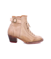 A women's Oak Tree Farms beige leather heeled boot with a wooden heel named Seal.