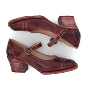 A pair of women's burgundy Mary Jane style leather shoes by Oak Tree Farms.
